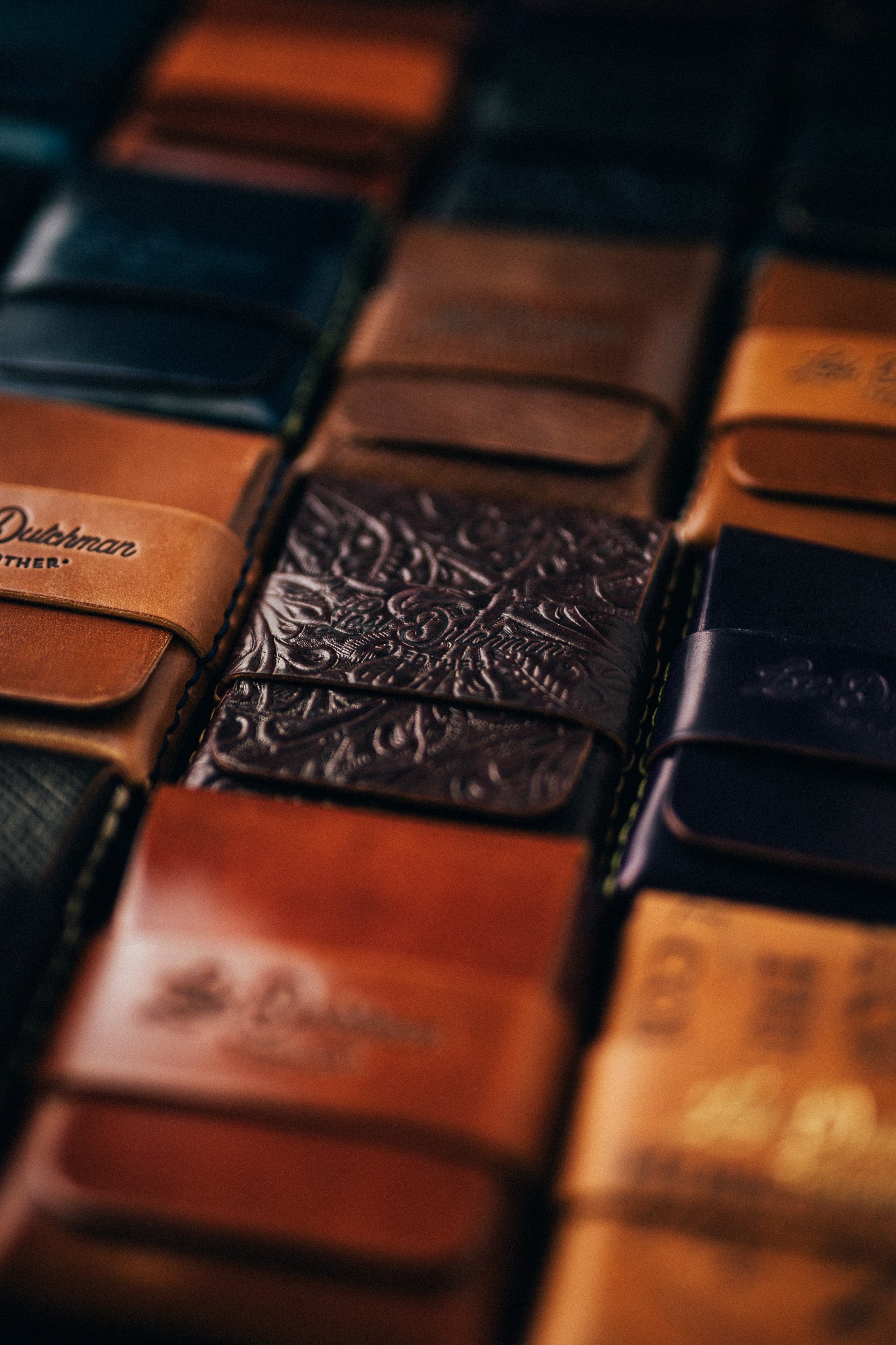 Close-up of stacked folded leather wallets