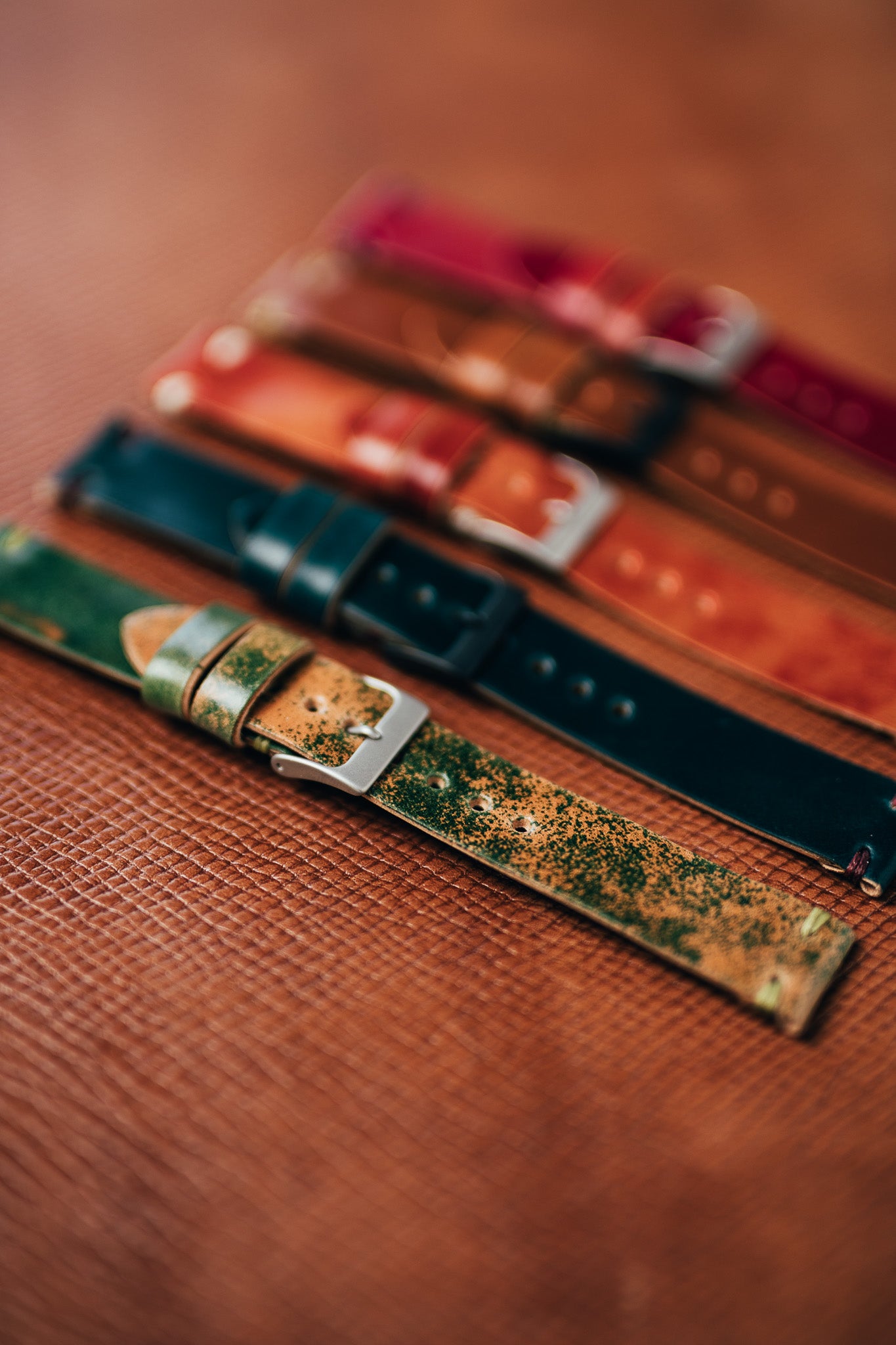 Patterned leather watch strap with a red leather strap