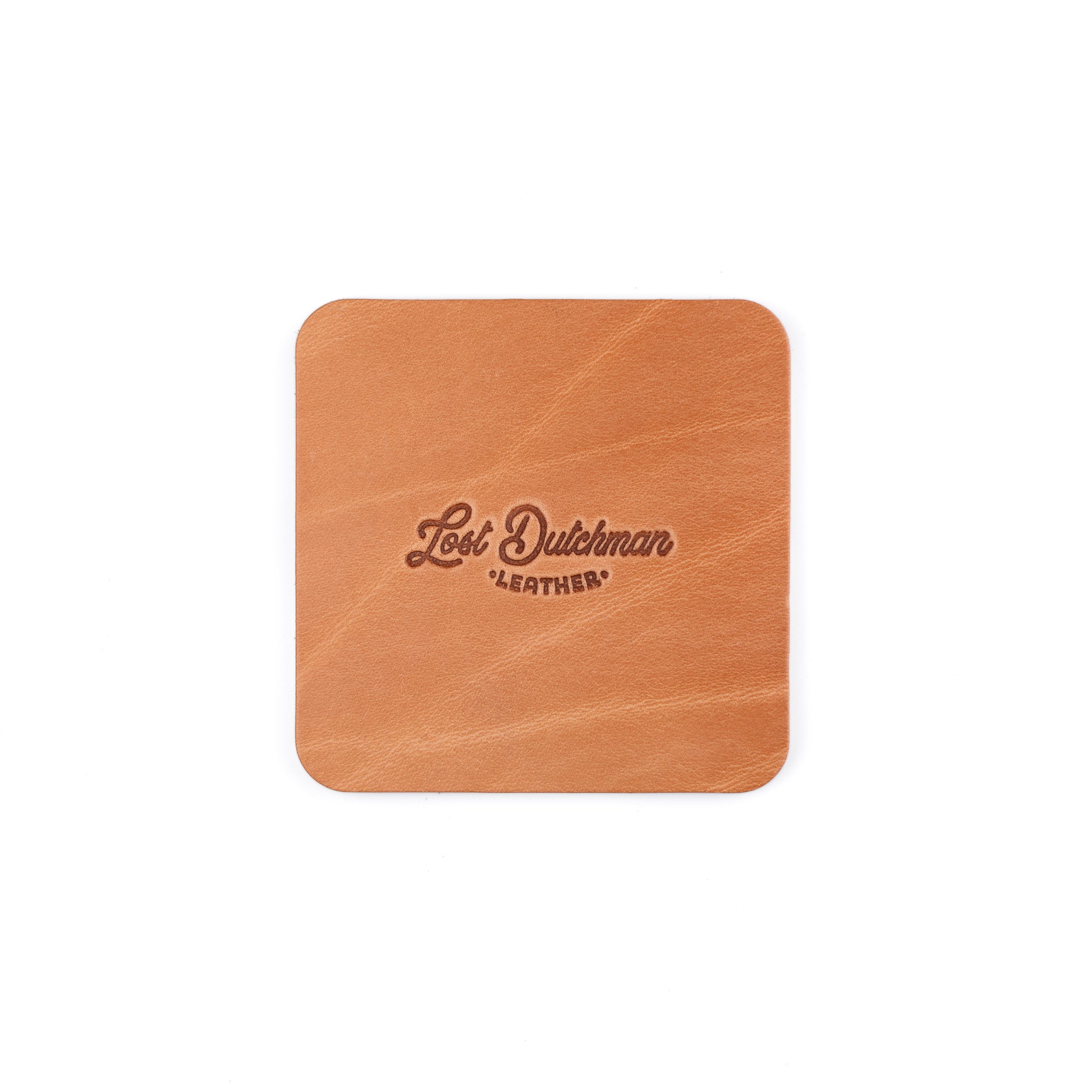 Russet leather coaster with 'Lost Dutchman Leather' branding on a white background