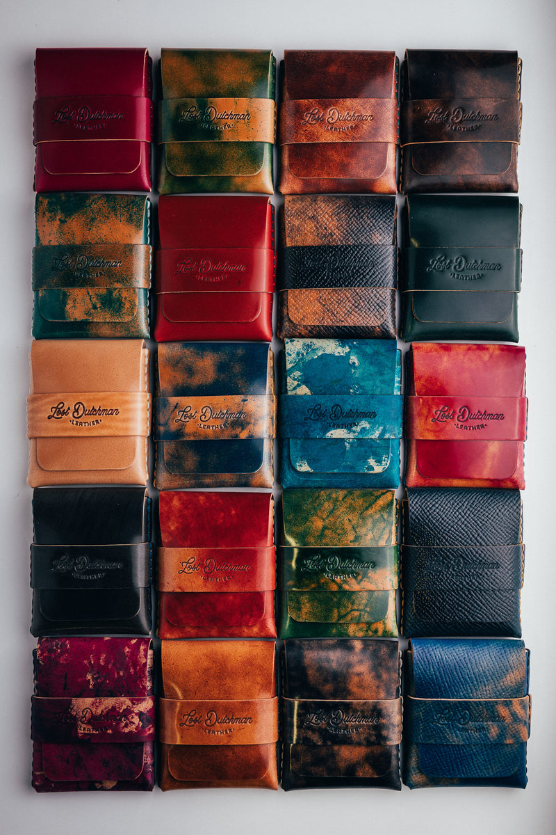 Grid of folded leather wallets in varied colours