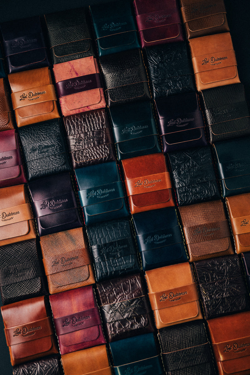 Grid of folded leather wallets in assorted colours